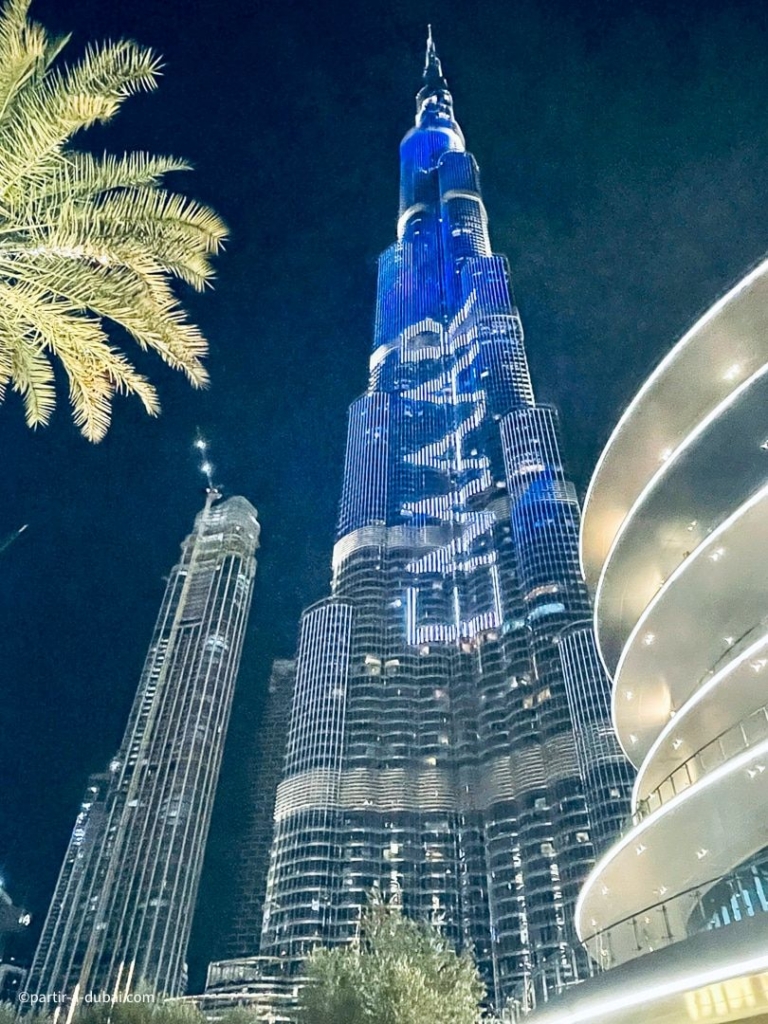 Burj Khalifa at night, illuminated with the name of Emaar, the tower’s builder